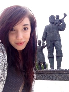 Me, with the statue of St Nick & children in Demre, Turkey